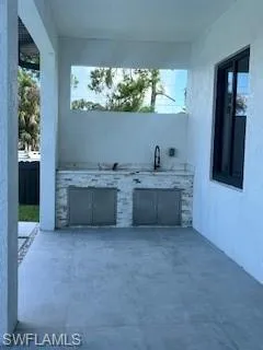 View of patio with an outdoor kitchen