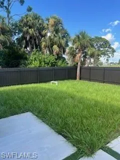 Fenced yard with a patio area