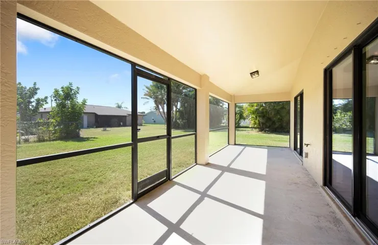 Unfurnished sunroom with vaulted ceiling and plenty of natural light