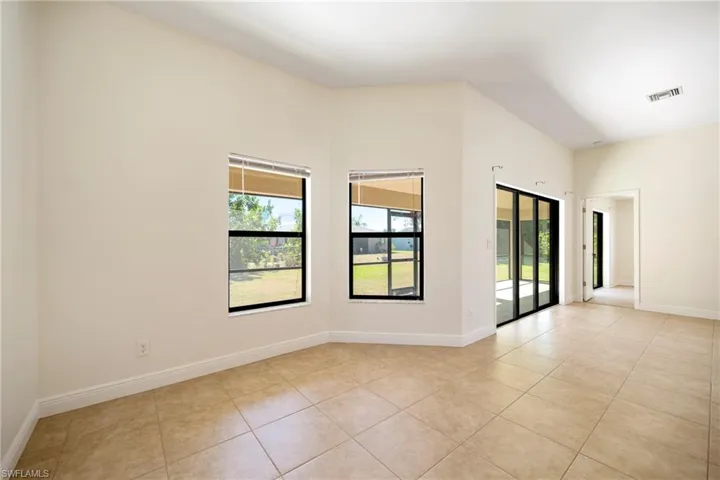 Spare room with light tile patterned flooring