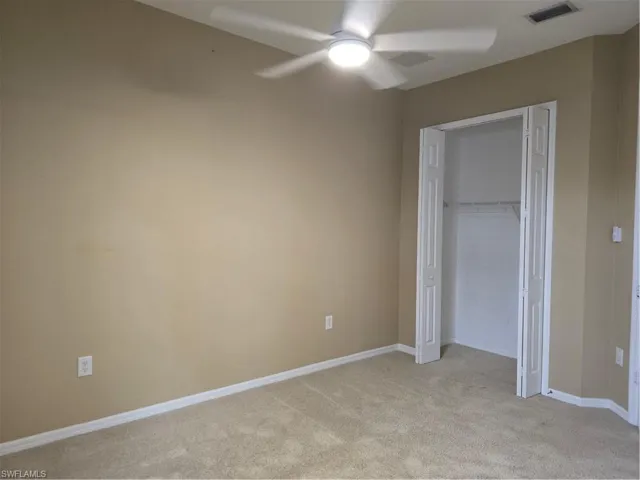Wall-to-wall carpeting with a neutral color palette