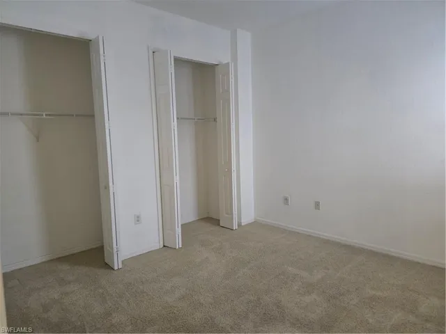 Wall-to-wall carpeting with 2 bi-fold closet doors and built-in shelving