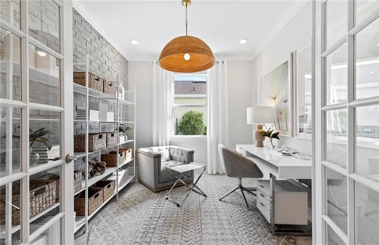 Carpeted office featuring ornamental molding