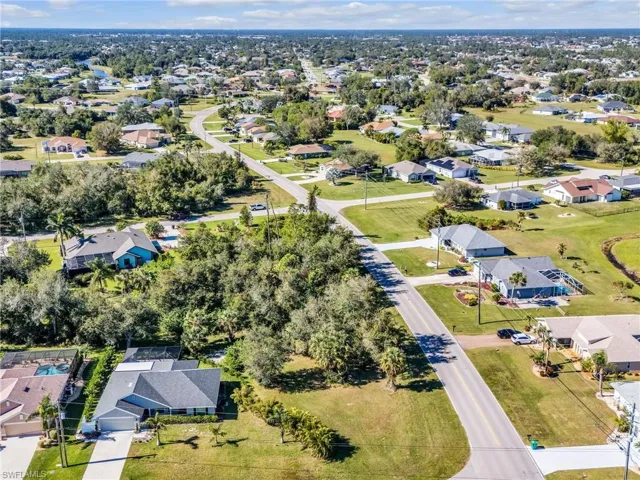 View of property location with nearby suburban area
