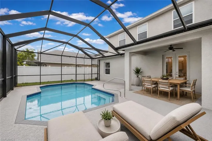 Digitally staged lanai furniture with swimming pool and screened enclosure