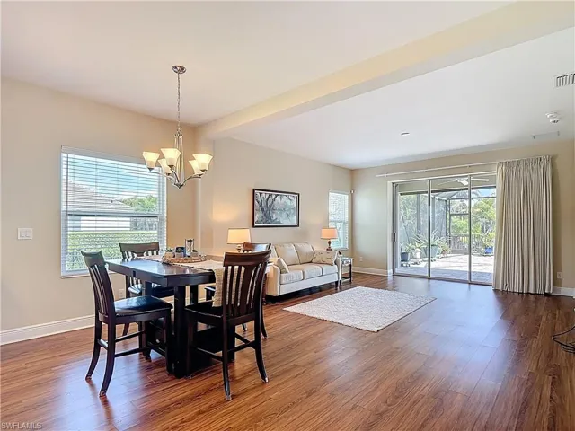 View of dining and living area, nice laminate flooring!