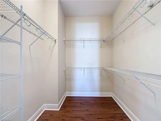 Primary bedroom walk in closet