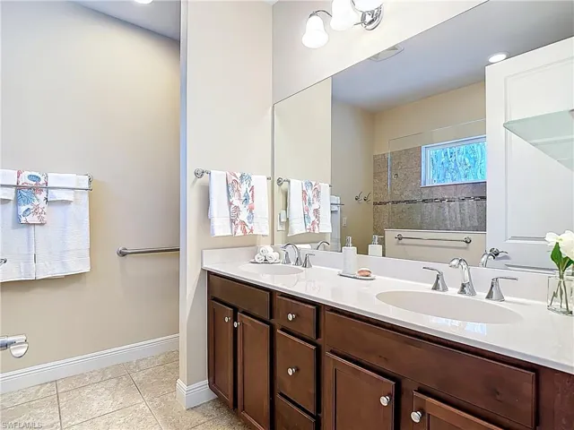 Double sinks and wooden cabinets