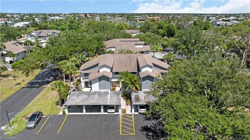 Aerial perspective of suburban area with a tree filled landscape