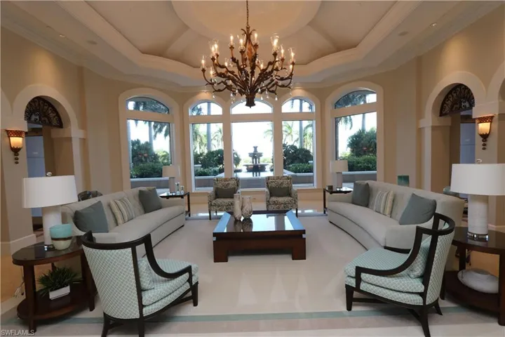 Community lobby featuring ornamental molding and a high ceiling