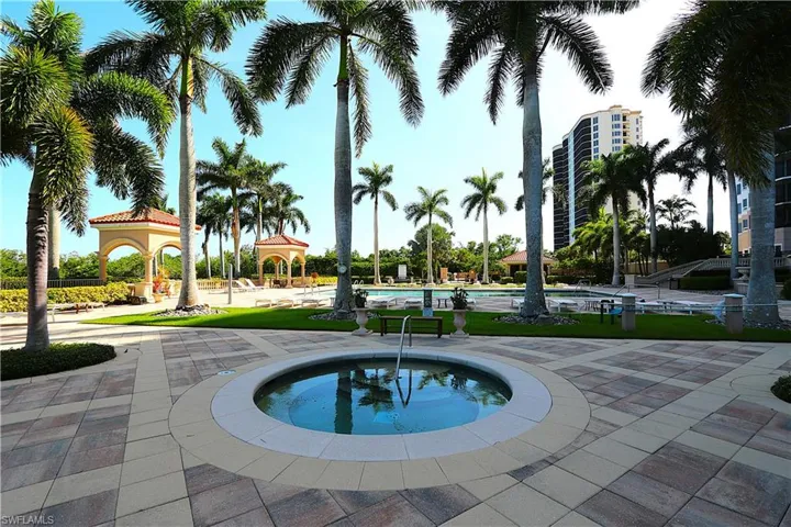 Community pool featuring a gazebo, a community hot tub, and a patio