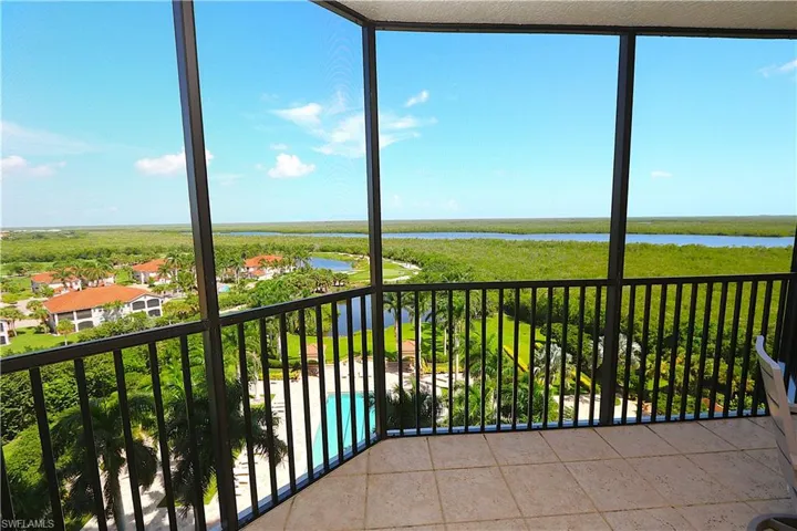 Unfurnished sunroom featuring a water view