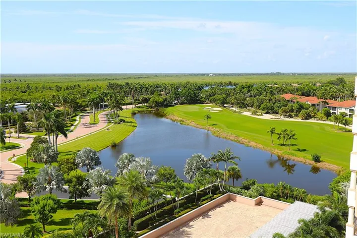 Aerial view of a nearby body of water and a golf course