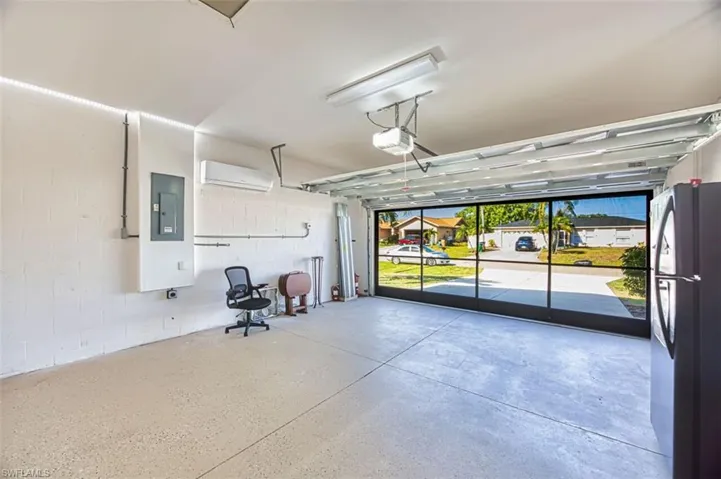 Garage with door open and screened sliders for an open breeze