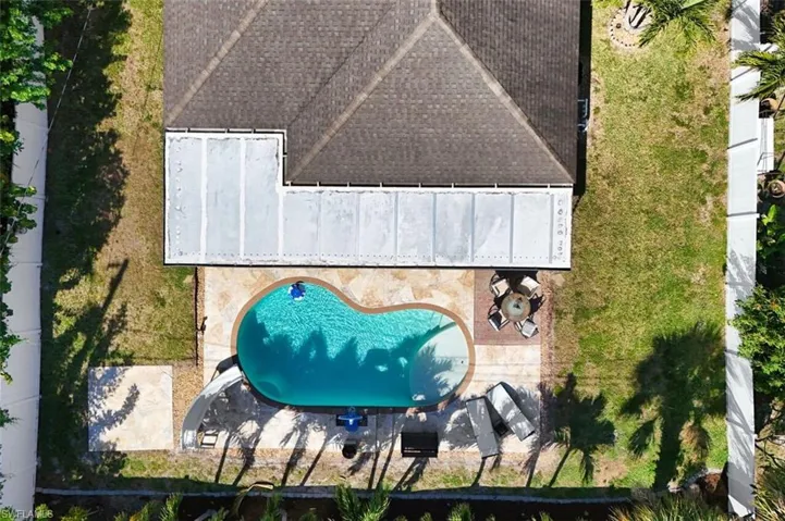 Pool, deck and backyard aerial view