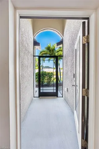 Screened entryway with decorative door