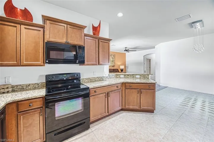 Granite countertops and an attached breakfast bar