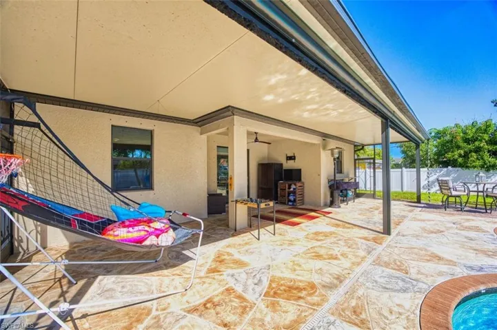 Large lanai (extends to the end of the house!) With electric roll-down screens for your enjoyment!