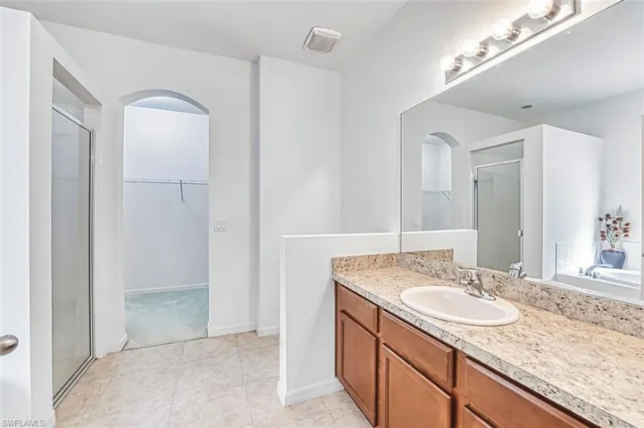 Master bath with separate shower and large walk-in closet