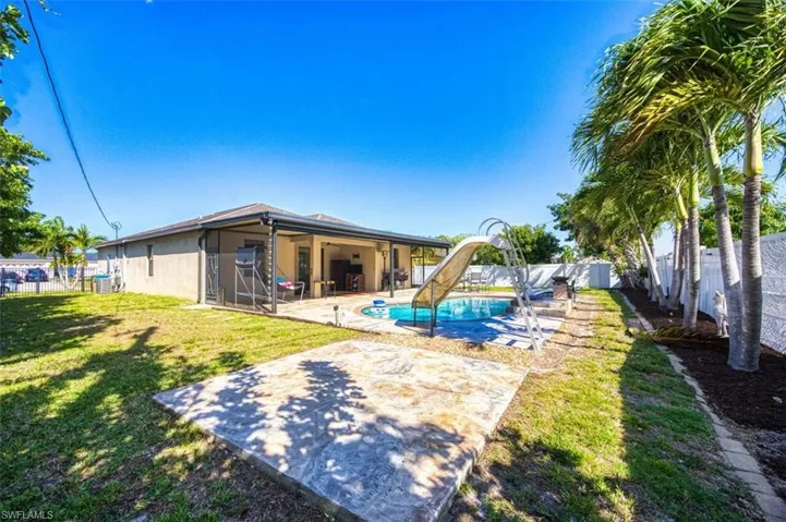 Backyard with an extra area for a fire pit or barbecuing