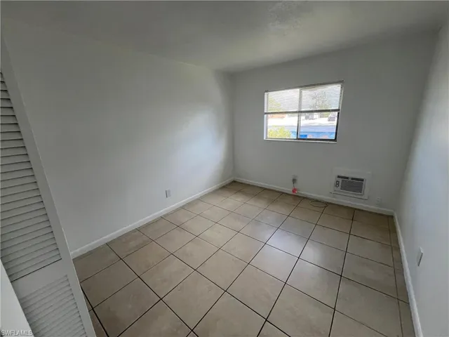Unfurnished room featuring light tile patterned floors