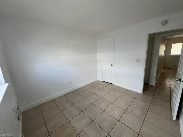 Unfurnished bedroom with tile patterned floors