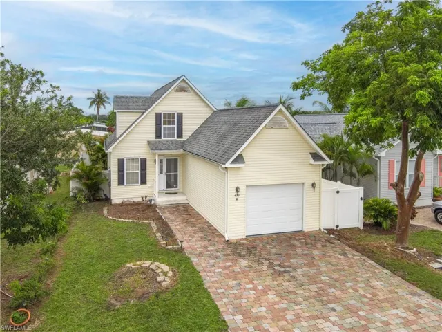 View of property with a garage