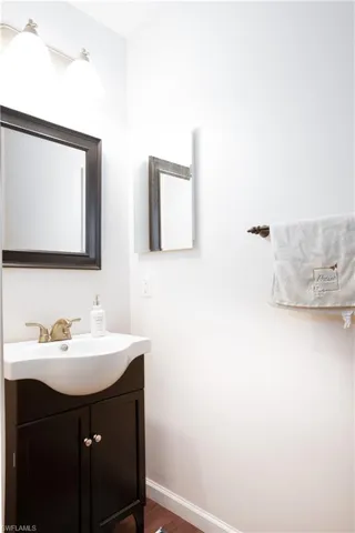 Bathroom with vanity and hardwood / wood-style floors