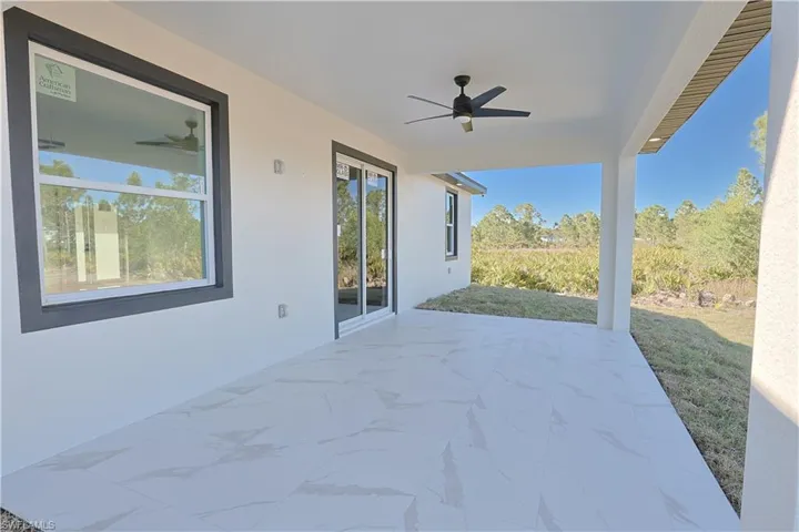 View of patio with a ceiling fan