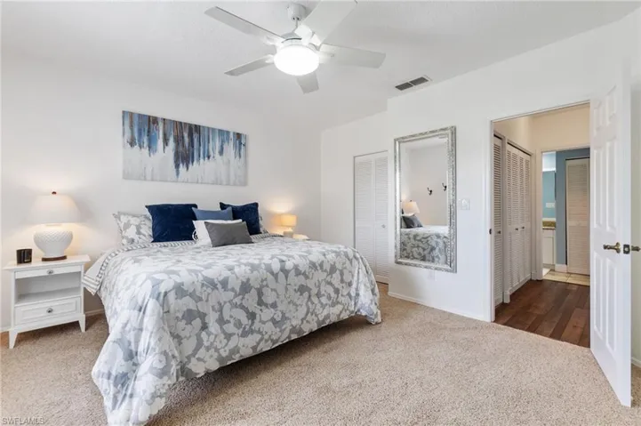 Large guest bedroom with walk-in closet.  Shown here fully furnished