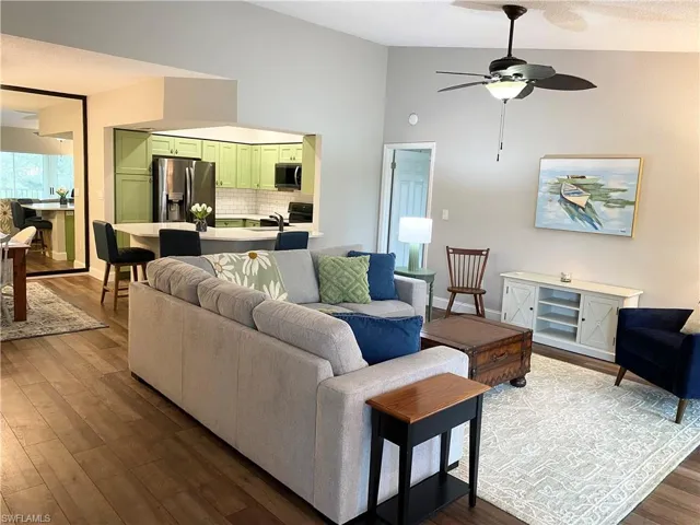 Large living space fits sectional sofa, vaulted ceiling