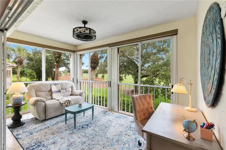 View of sunroom/lanai.  Glass doors open to screens for indoor/ourdoor living (shown here fully furnished)
