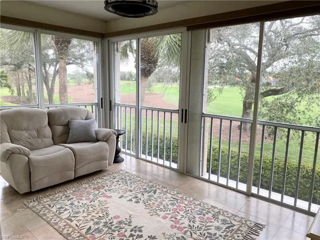 View of sunroom/lanai.  Glass doors open to screens for indoor/ourdoor living