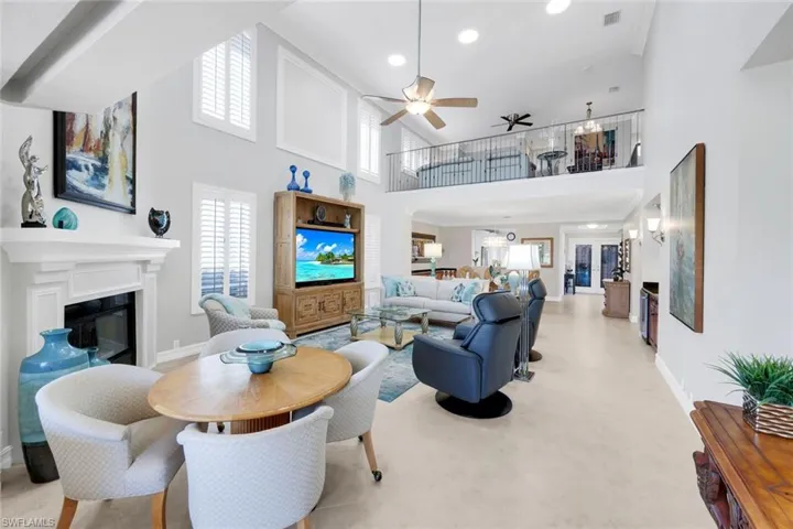 Great room with vaulted ceiling & plenty of natural light.