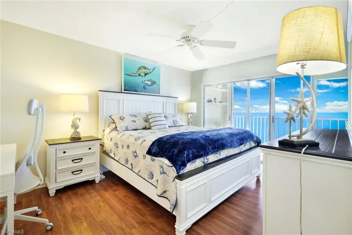 Bedroom featuring dark wood-type flooring and a ceiling fan