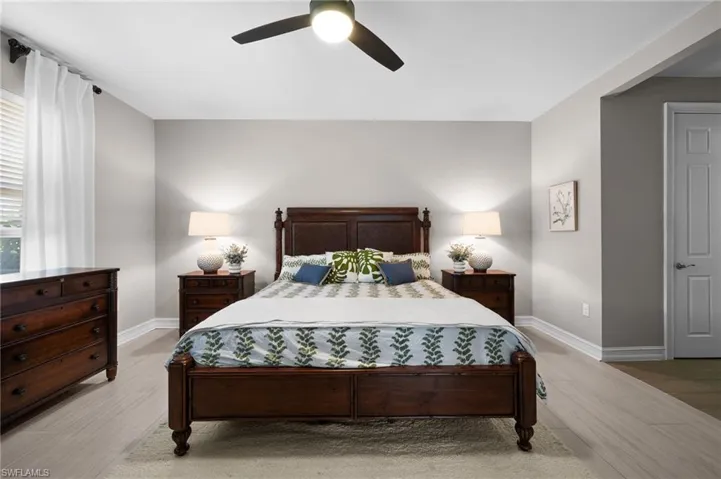 Bedroom featuring light hardwood / wood-style floors and ceiling fan
