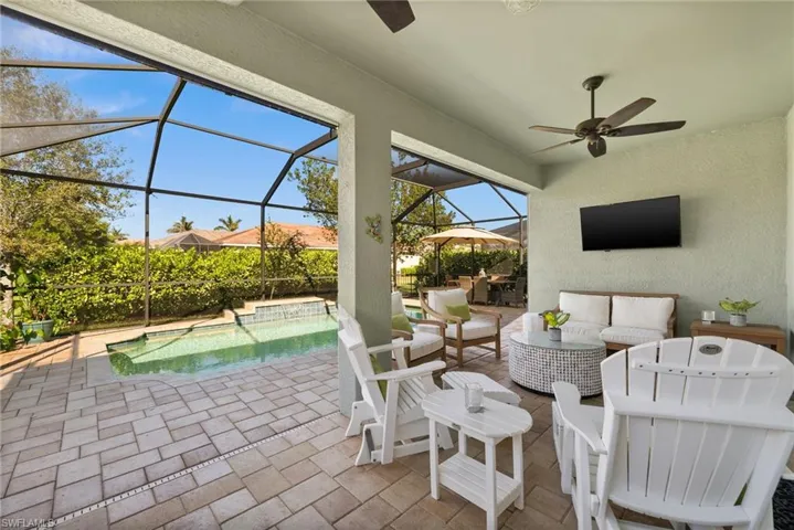 View of patio / terrace with outdoor lounge area, ceiling fan, and a lanai