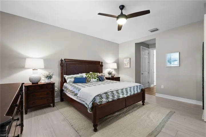 Bedroom featuring ceiling fan and light wood-type flooring