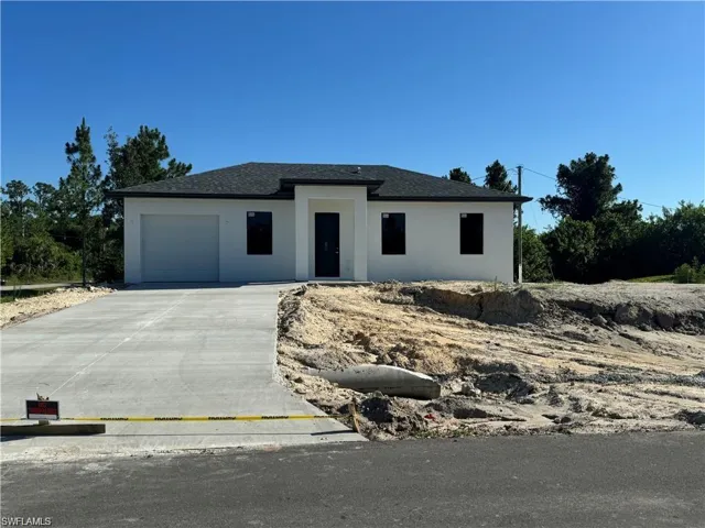 View of front of property with a garage