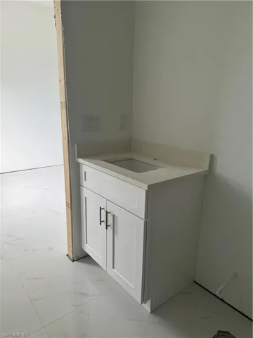 Bathroom featuring tile flooring
