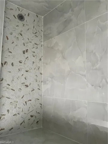 Bathroom featuring tiled shower