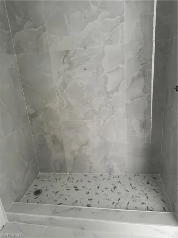 Bathroom with a tile shower