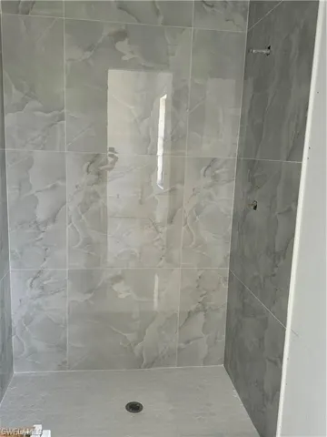 Bathroom featuring tiled shower