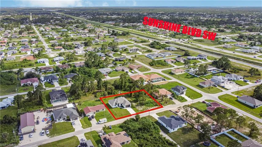 Aerial view of residential area featuring property parcel outlined