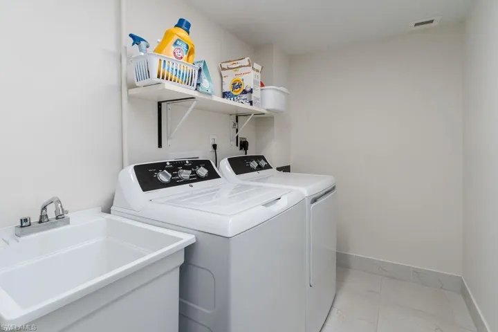 Laundry is immediately outside unit's front door.