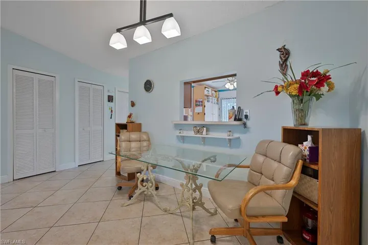 Tiled dining room with baseboards