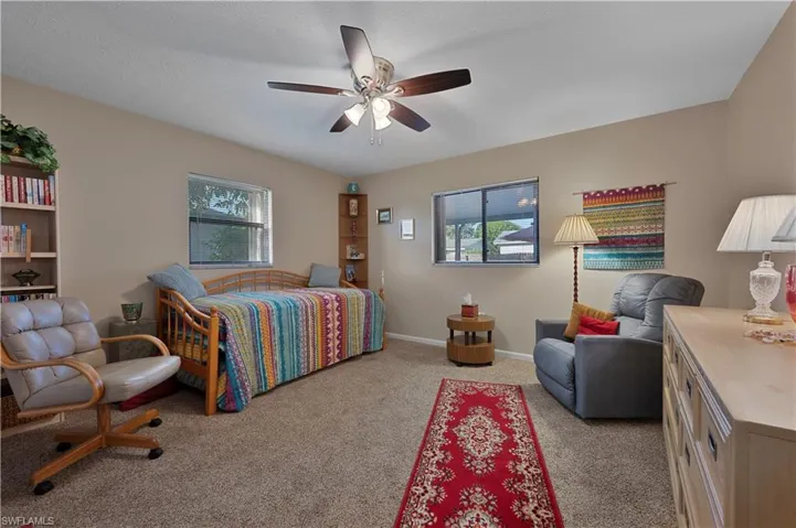 Bedroom with carpet flooring and a ceiling fan