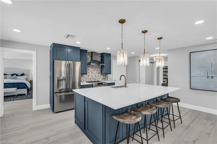 Spacious kitchen island with seating, perfect for casual dining - Virtually Edited Image