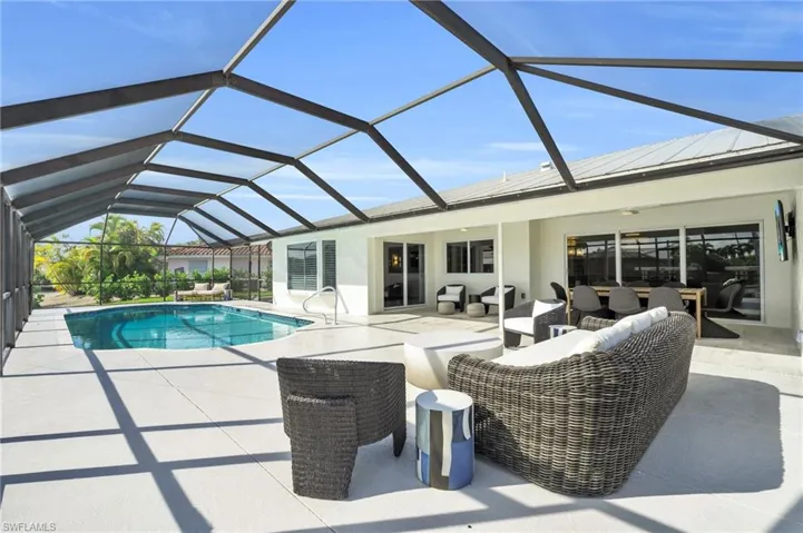Tranquil screened pool area, perfect for evening relaxation - Virtually Edited Image