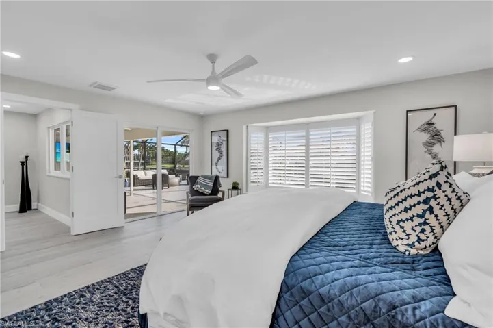 Master Bedroom #1 Furnished master bedroom designed for comfort and style with outdoor access - Virtually Edited Image